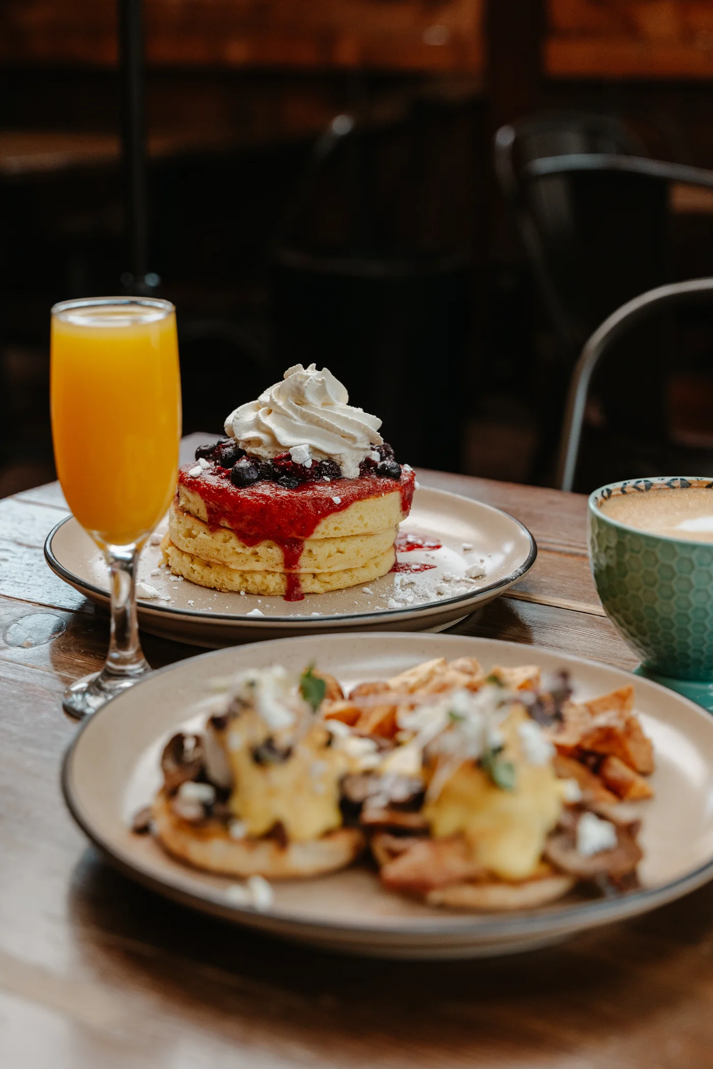 A delicious brunch spread at Crabapple Café featuring pancakes and eggs benedict